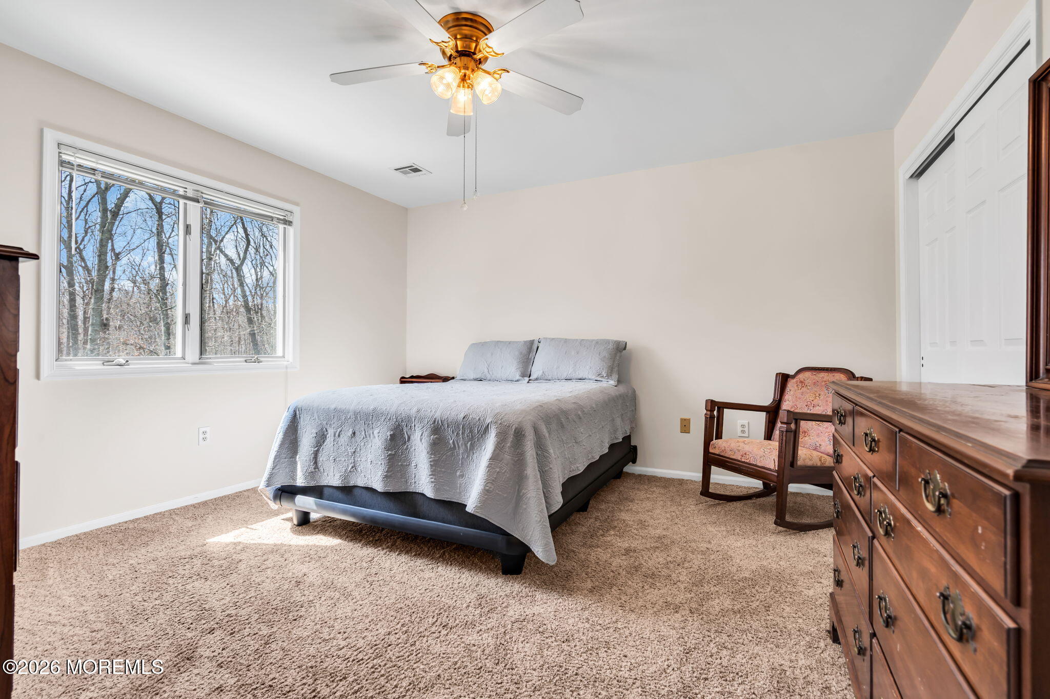 250 Bent Hook Road Toms River, NJ 08755 - Photo 37 of 63 a spacious bedroom with a bed and a chandelier