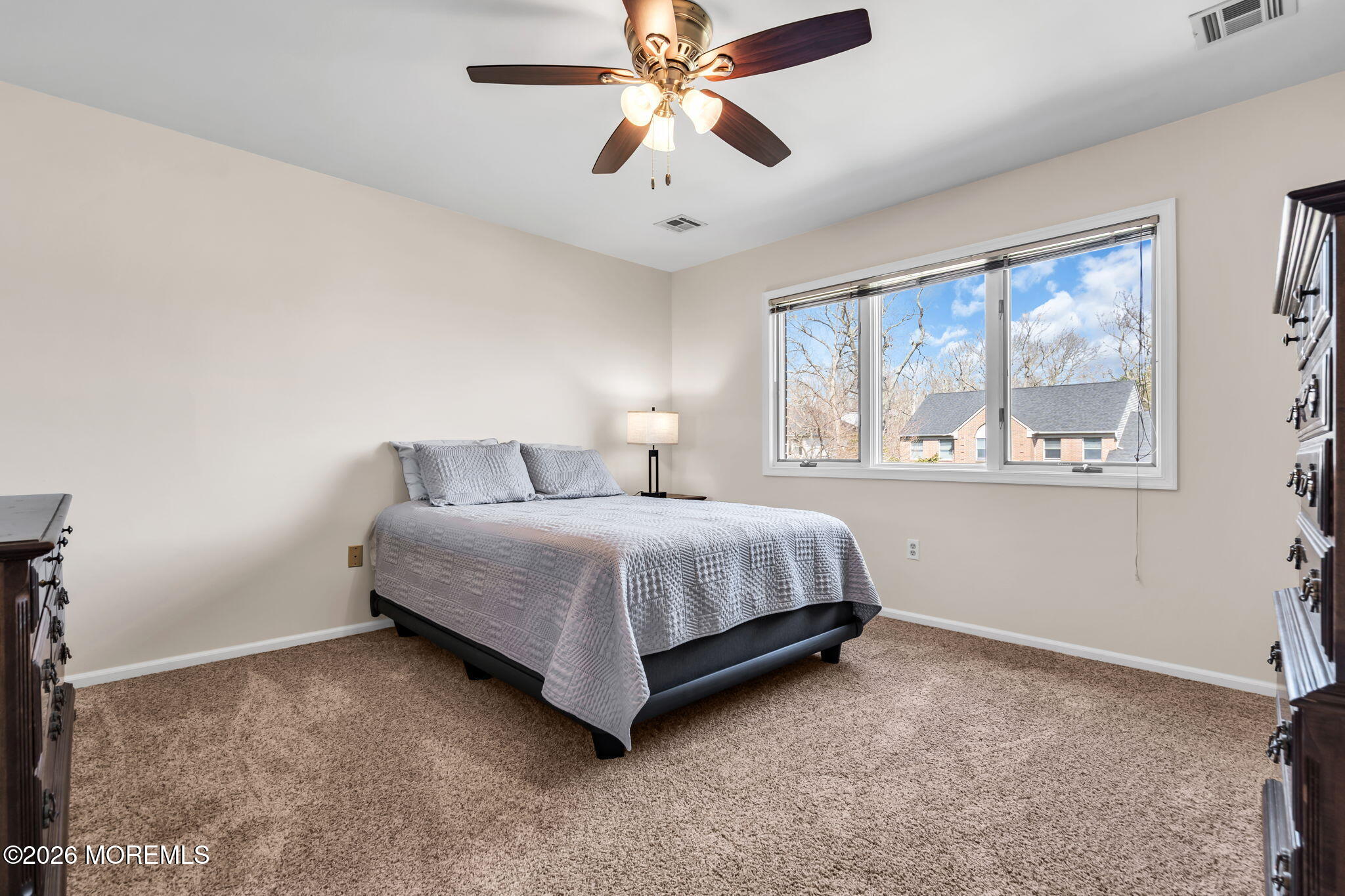 250 Bent Hook Road Toms River, NJ 08755 - Photo 39 of 63 a spacious bedroom with a bed and a chandelier