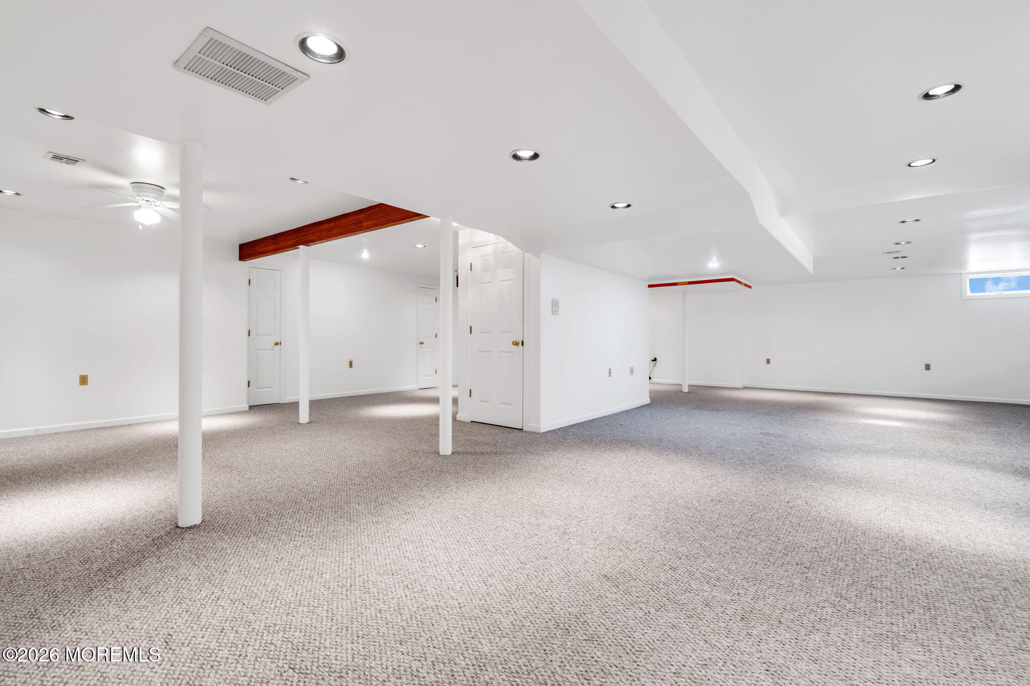 250 Bent Hook Road Toms River, NJ 08755 - Photo 44 of 63 an empty room with an entryway and a ceiling fan