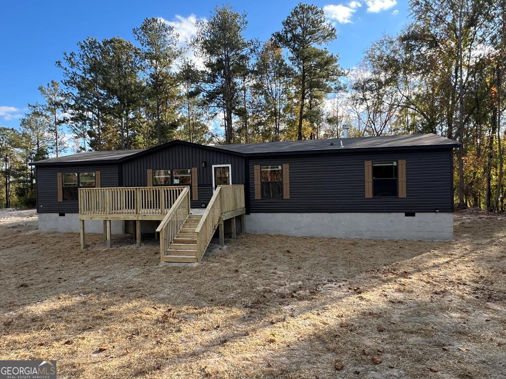 156-j F Hall Road Gordon, GA 31031 - Photo 1 of 13 a front view of a house with garden