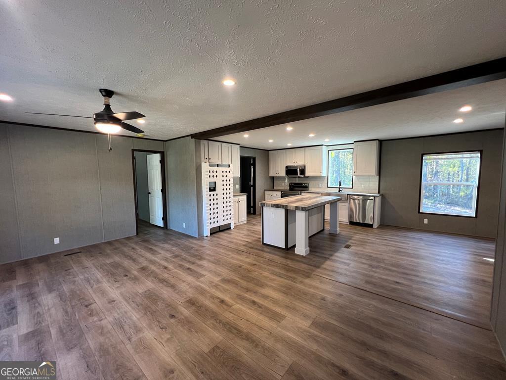 156-j F Hall Road Gordon, GA 31031 - Photo 13 of 13 a view of an empty room with a window and wooden floor