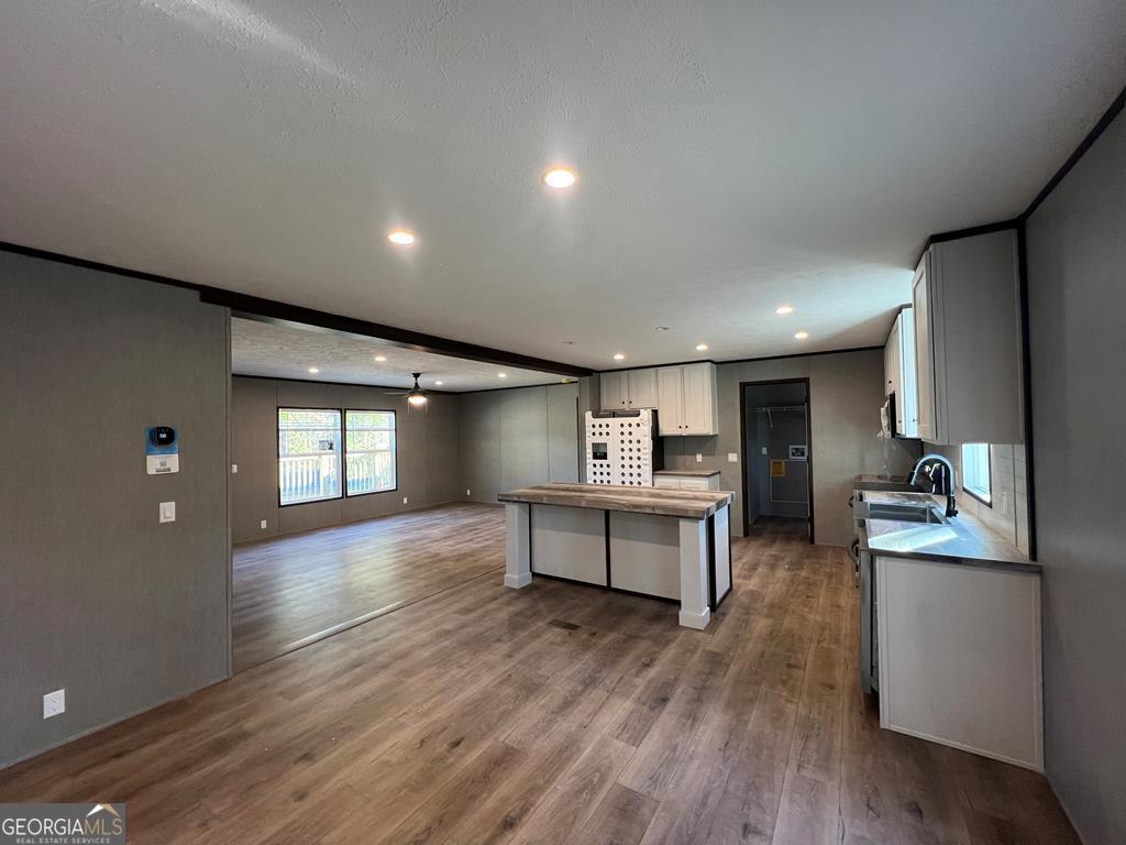 156-j F Hall Road Gordon, GA 31031 - Photo 2 of 13 a view of a kitchen with cabinets and wooden floor