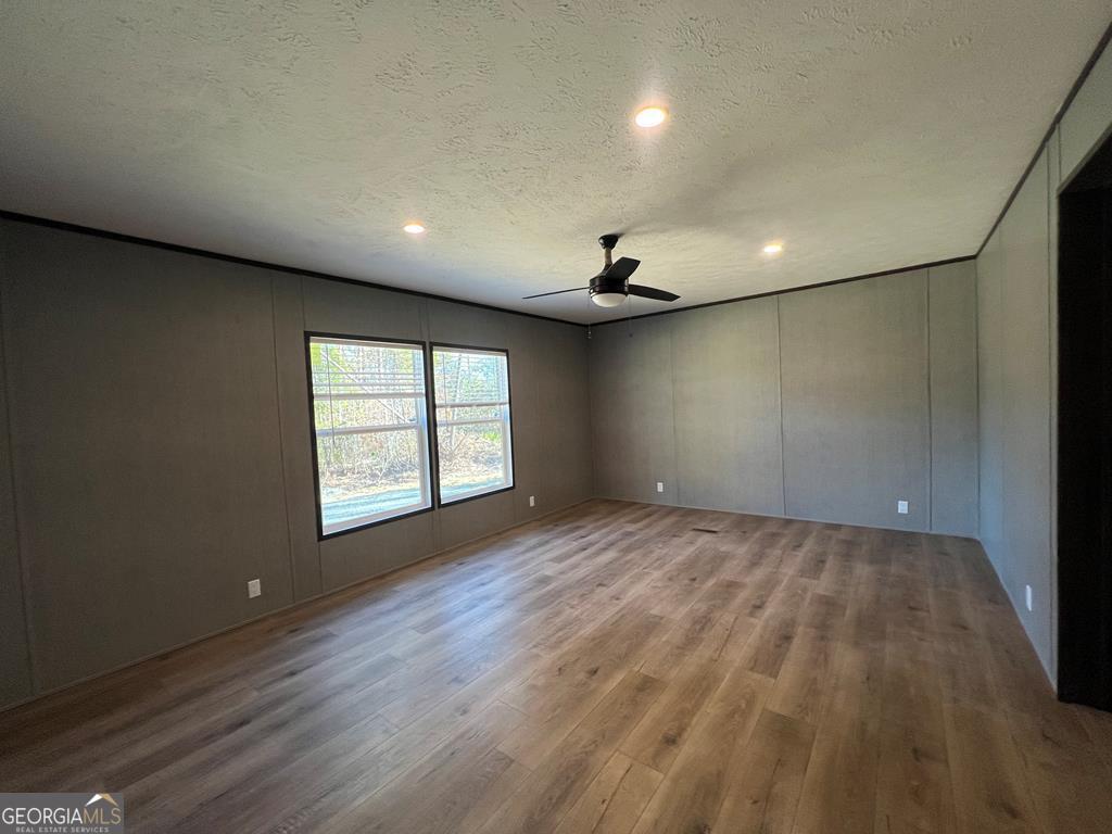 156-j F Hall Road Gordon, GA 31031 - Photo 6 of 13 an empty room with wooden floor and windows