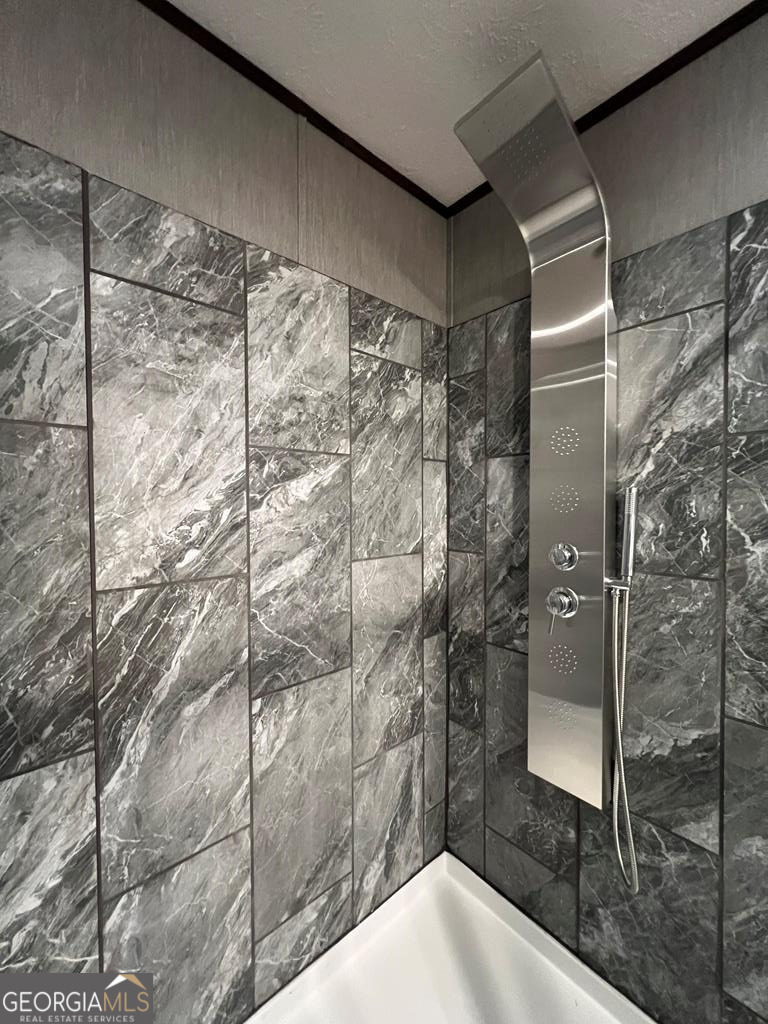 156-j F Hall Road Gordon, GA 31031 - Photo 8 of 13 a bathroom with a shower and a sink