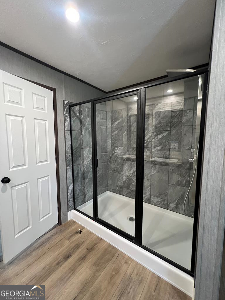 156-j F Hall Road Gordon, GA 31031 - Photo 10 of 13 a view of empty room with wooden floor and fan