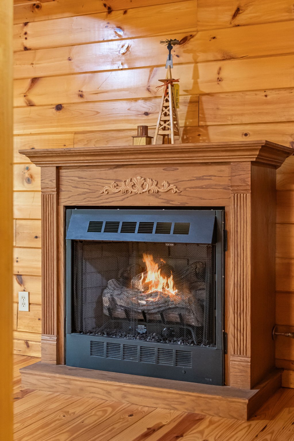 5740 North Lick Creek Road Franklin, TN 37064 - Photo 14 of 100 a fireplace with a wooden floor