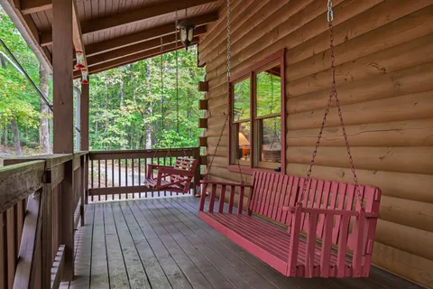 a view of a balcony with wooden floor