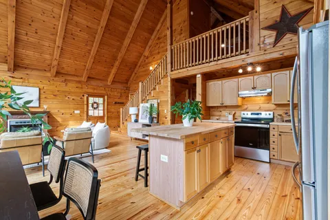 a bathroom with a granite countertop sink and a toilet