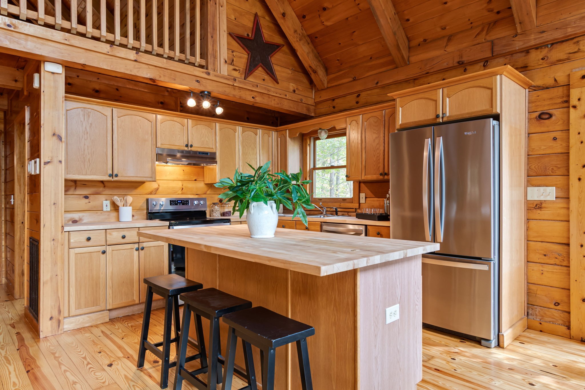 5740 North Lick Creek Road Franklin, TN 37064 - Photo 27 of 100 a kitchen with stainless steel appliances a refrigerator and a stove top oven