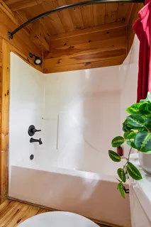 a view of balcony with wooden floor and outdoor seating