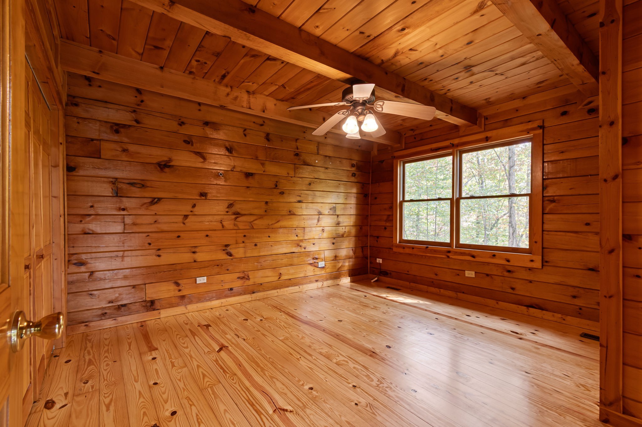 5740 North Lick Creek Road Franklin, TN 37064 - Photo 49 of 100 a view of empty room with wooden floor and fan