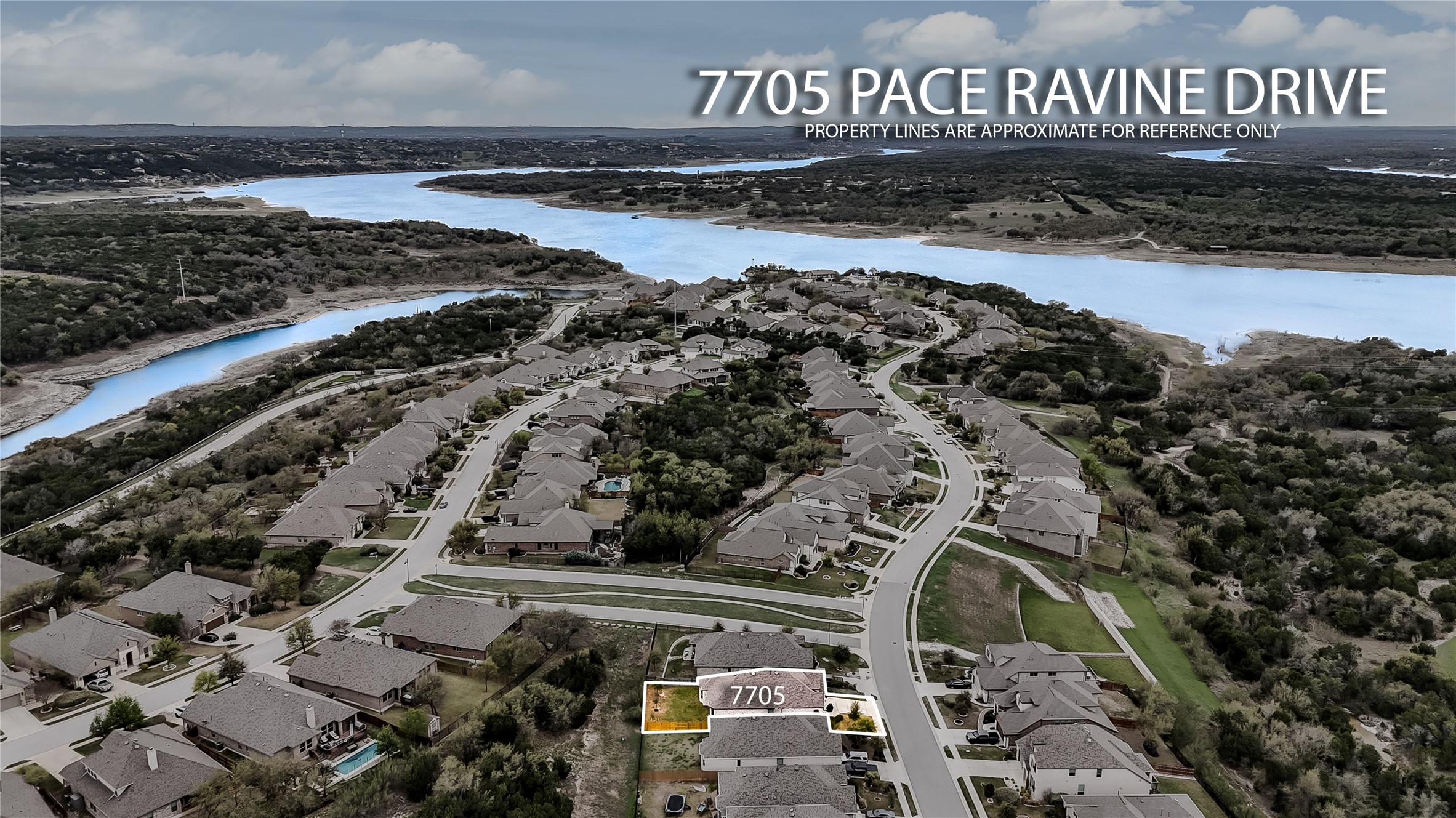 7705 Pace Ravine Drive Lago Vista, TX 78645 - Photo 29 of 40 Aerial perspective of suburban area featuring a large body of water