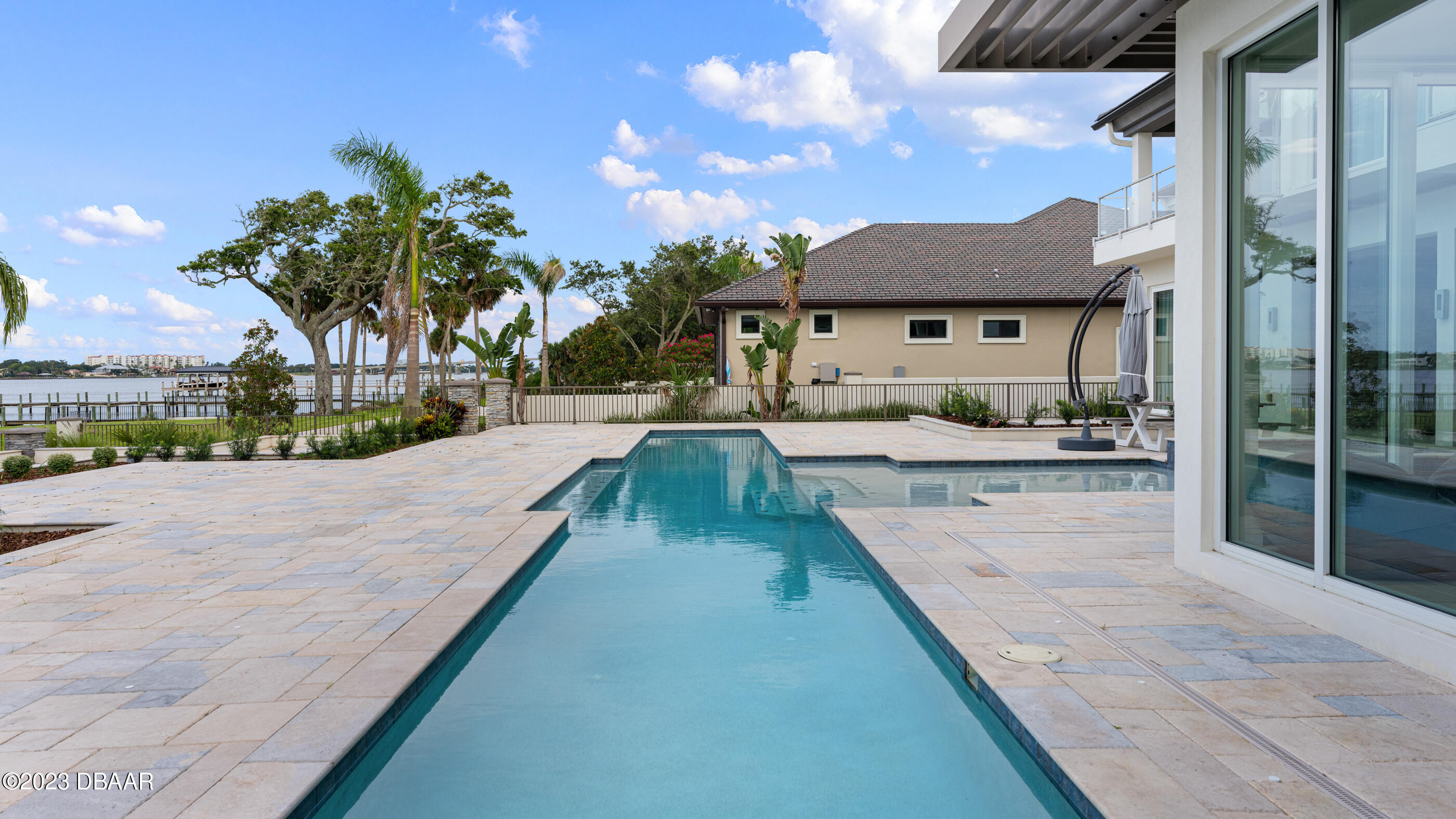 437 North Beach Street Ormond Beach, FL 32174 - Photo 106 of 162 a view of a house with a swimming pool and sitting area