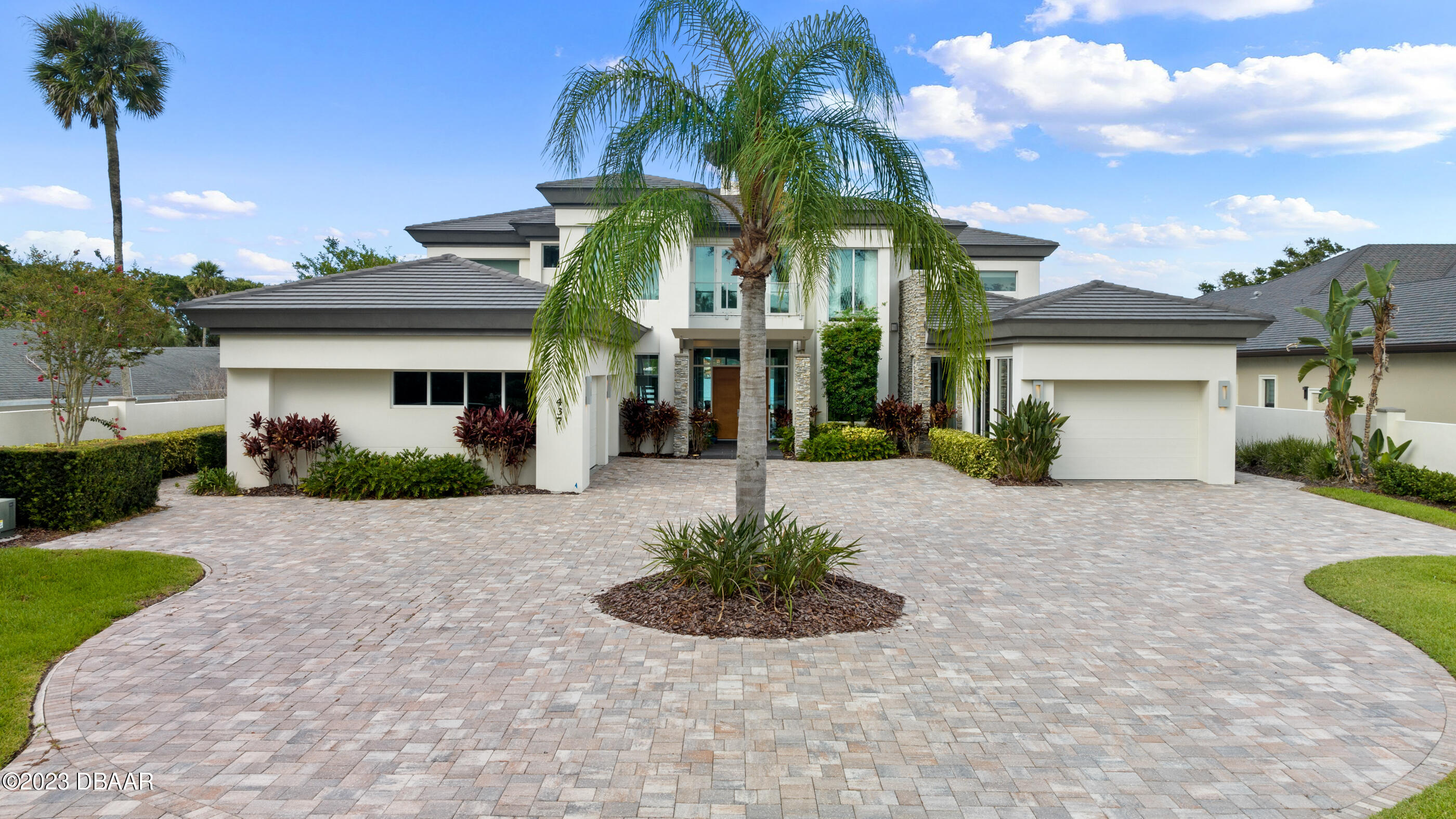 437 North Beach Street Ormond Beach, FL 32174 - Photo 115 of 162 a front view of a house with a yard and potted plants