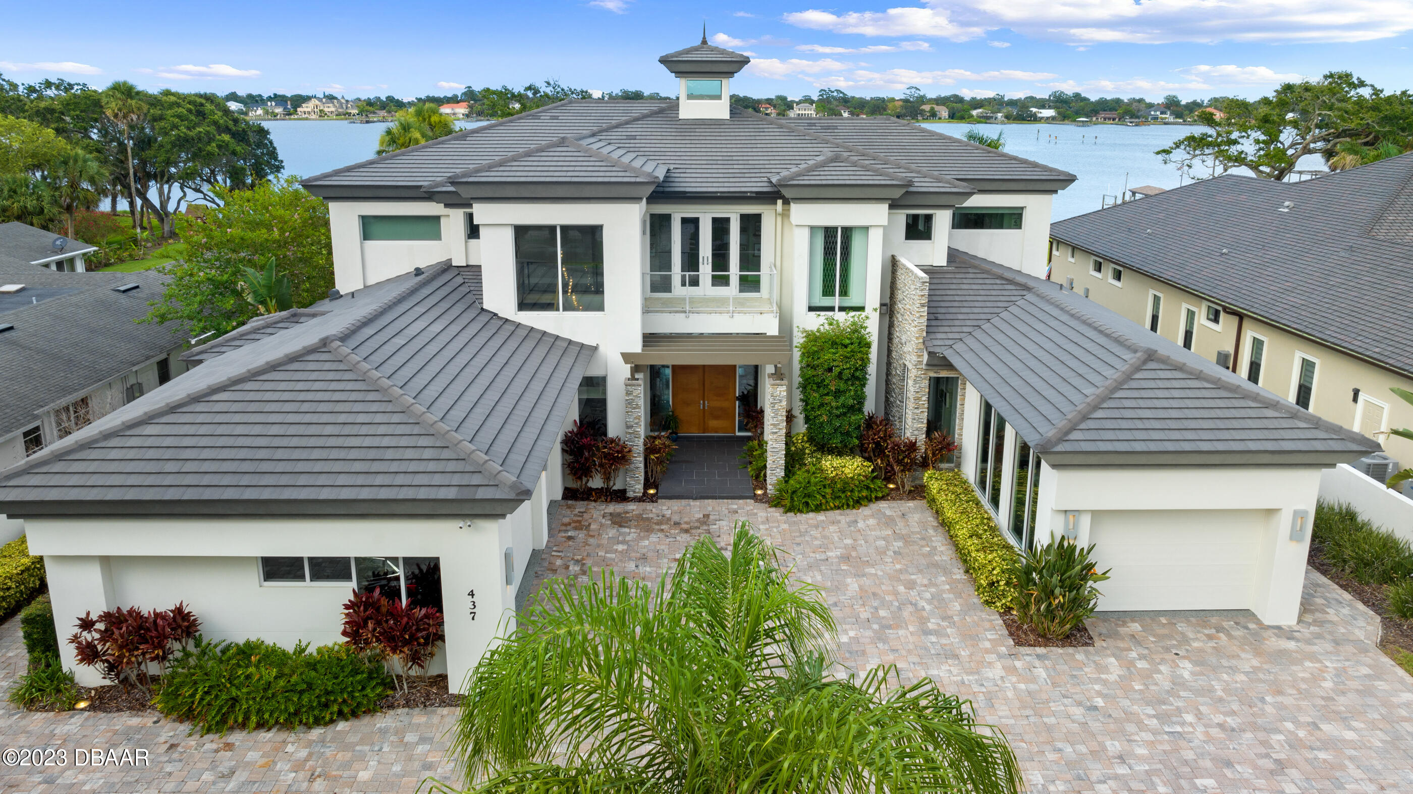 437 North Beach Street Ormond Beach, FL 32174 - Photo 131 of 162 a front view of a house with garden