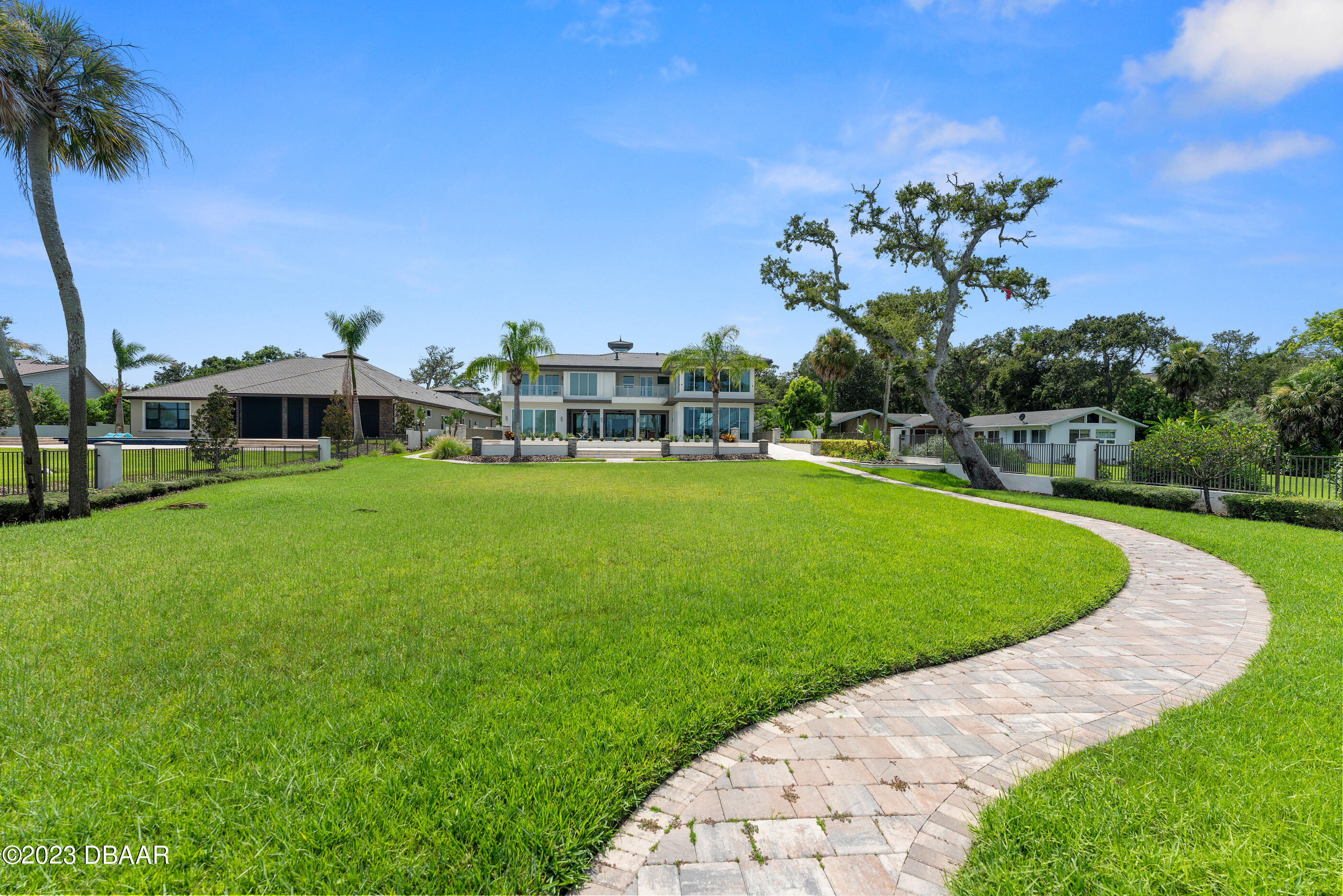 437 North Beach Street Ormond Beach, FL 32174 - Photo 133 of 162 a view of a house with a swimming pool