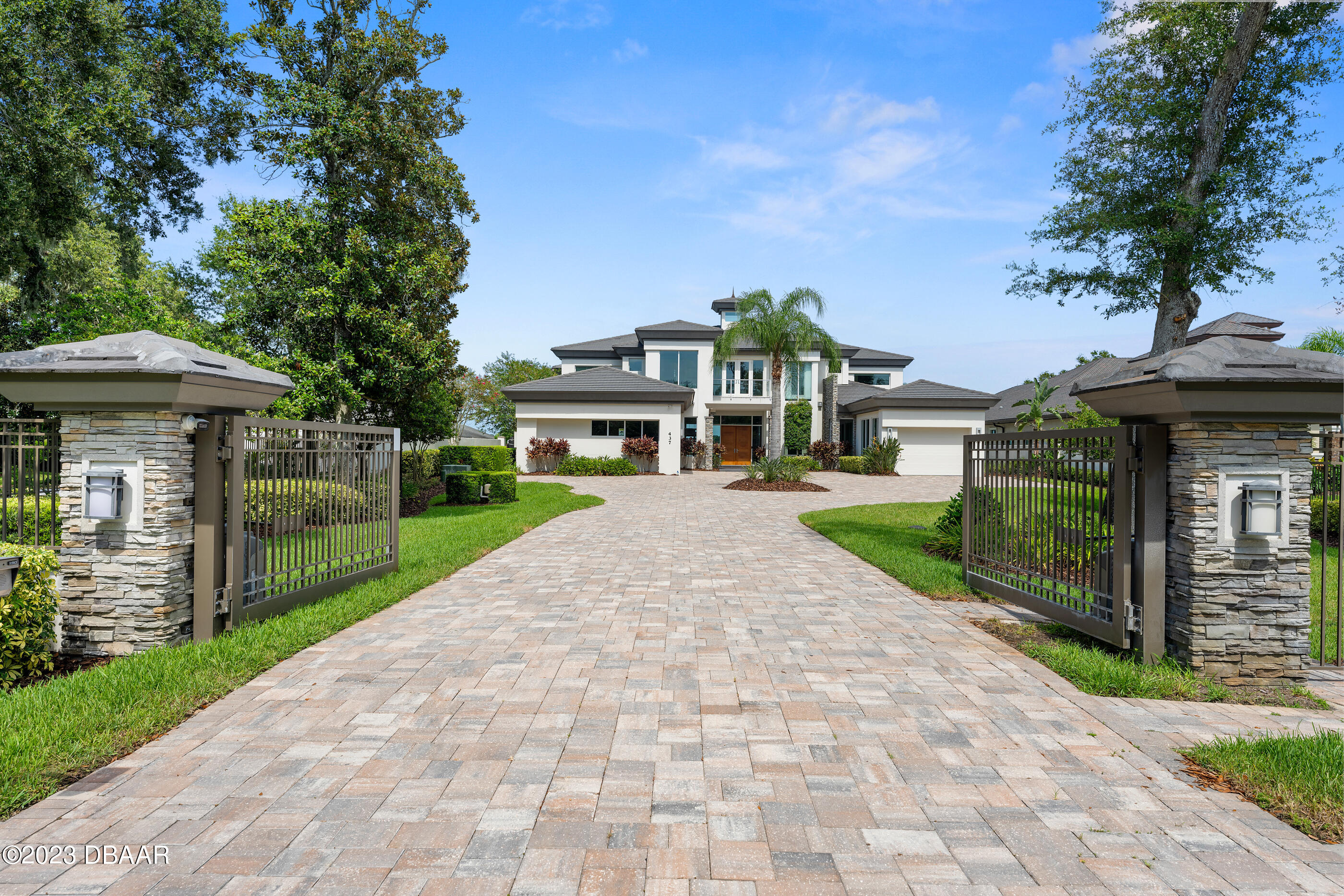 437 North Beach Street Ormond Beach, FL 32174 - Photo 142 of 162 a front view of a house with a garden and outdoor seating