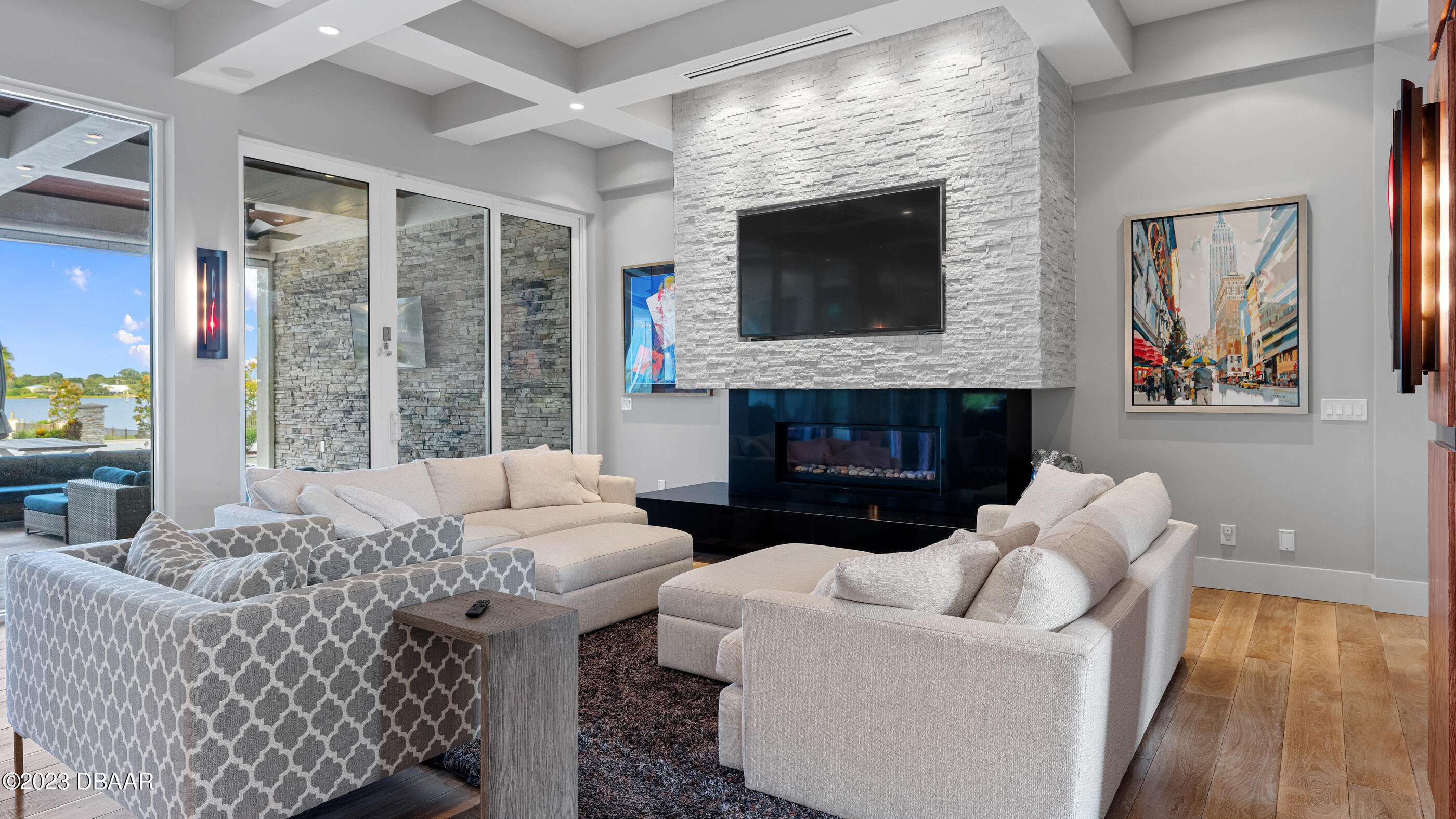 437 North Beach Street Ormond Beach, FL 32174 - Photo 15 of 162 a living room with furniture a flat screen tv and a fireplace