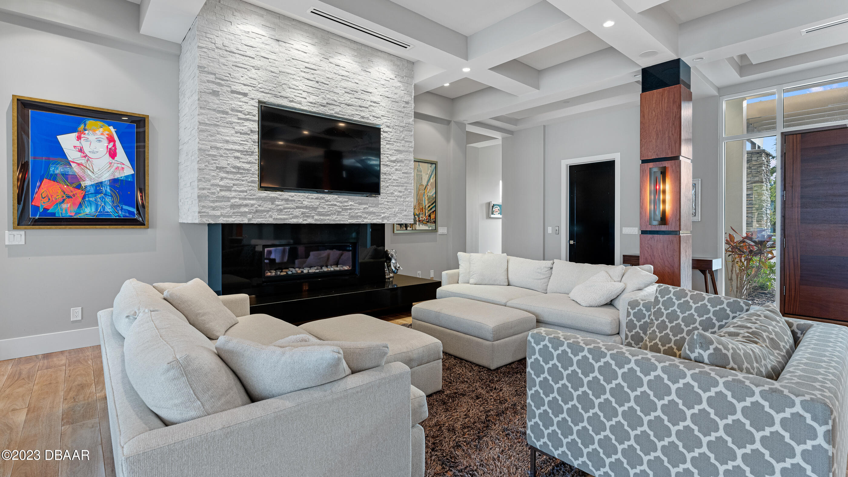 437 North Beach Street Ormond Beach, FL 32174 - Photo 16 of 162 a living room with furniture a flat screen tv and a fireplace