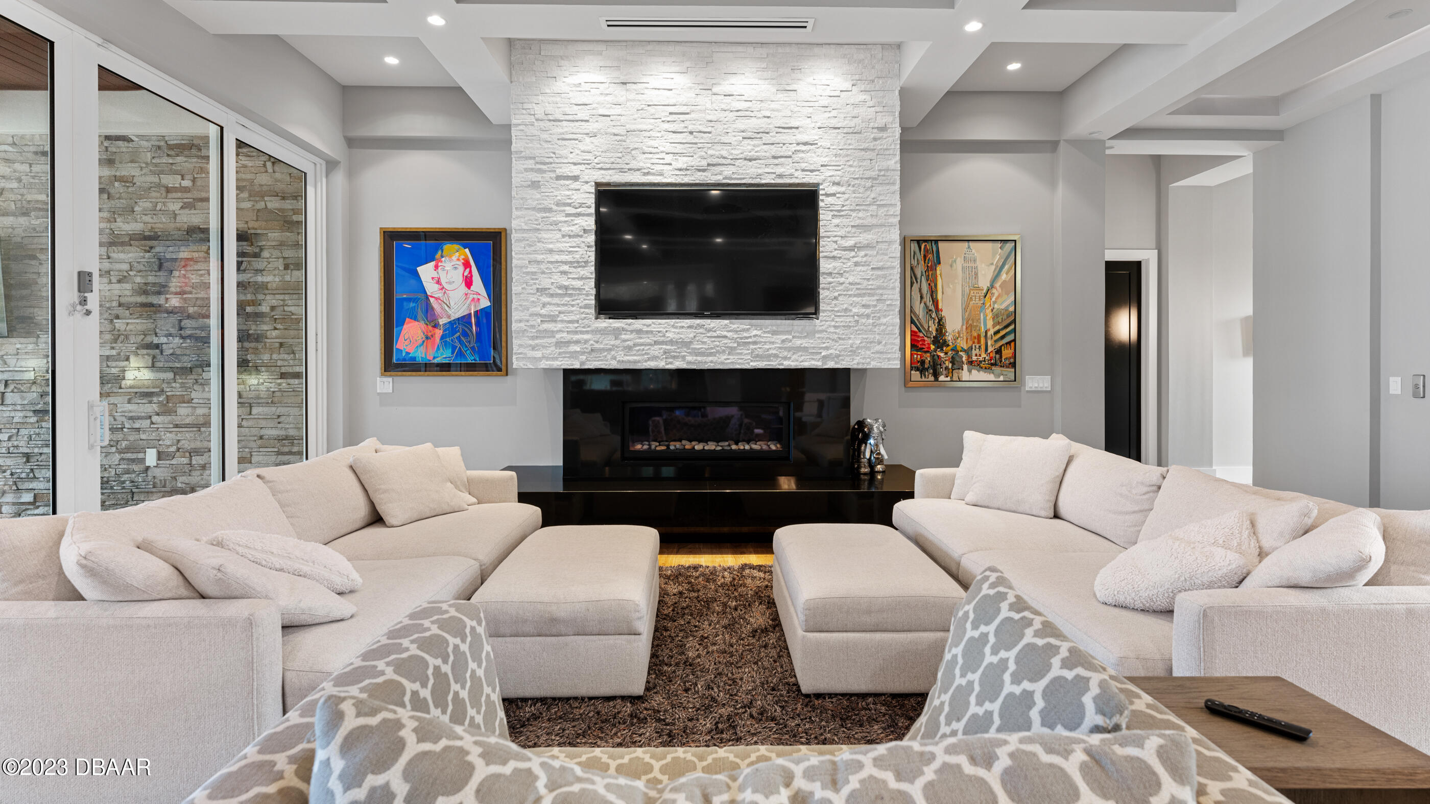 437 North Beach Street Ormond Beach, FL 32174 - Photo 17 of 162 a living room with furniture mirror and a fireplace