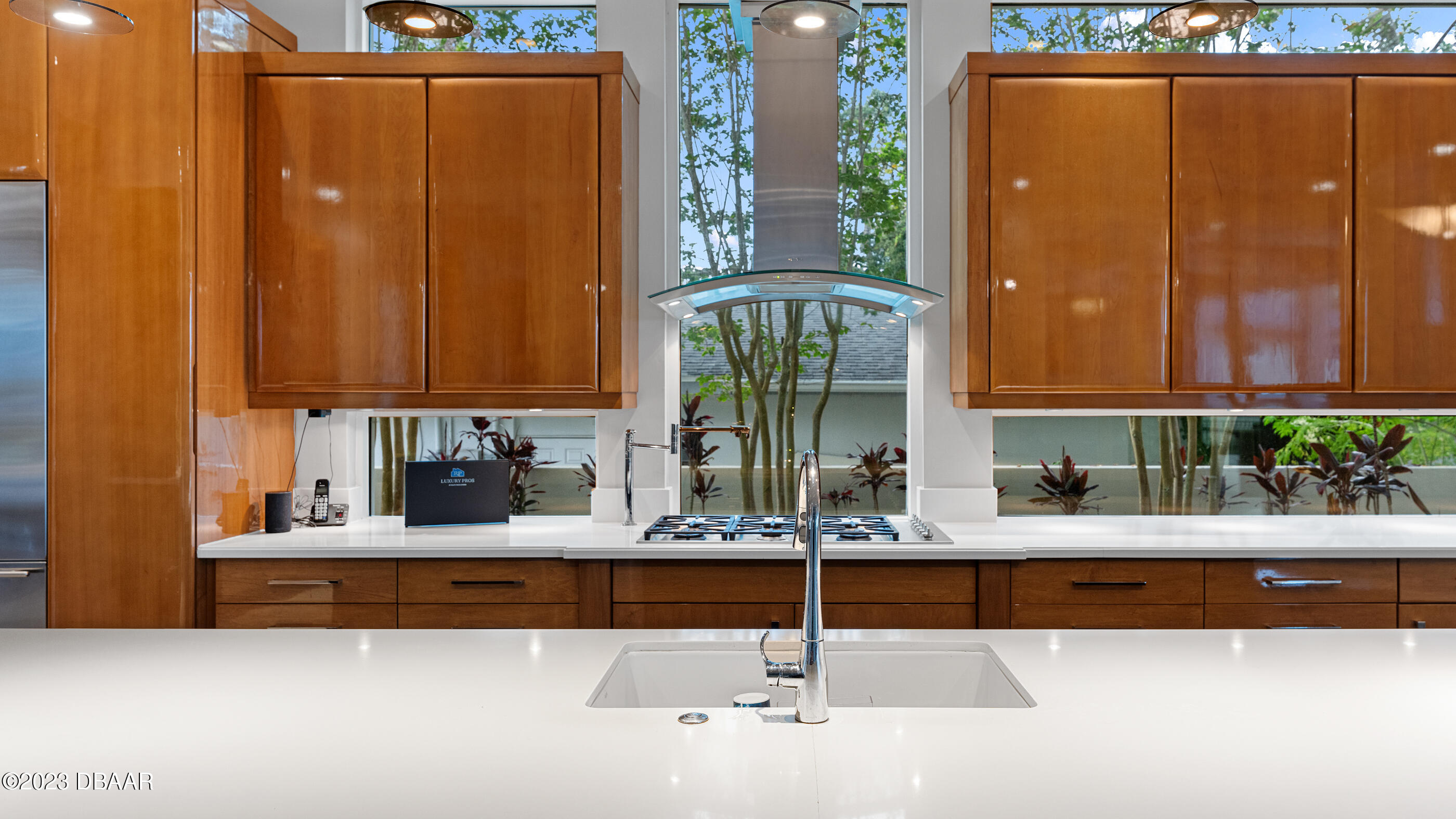 437 North Beach Street Ormond Beach, FL 32174 - Photo 26 of 162 a kitchen with kitchen island a counter top space and a sink