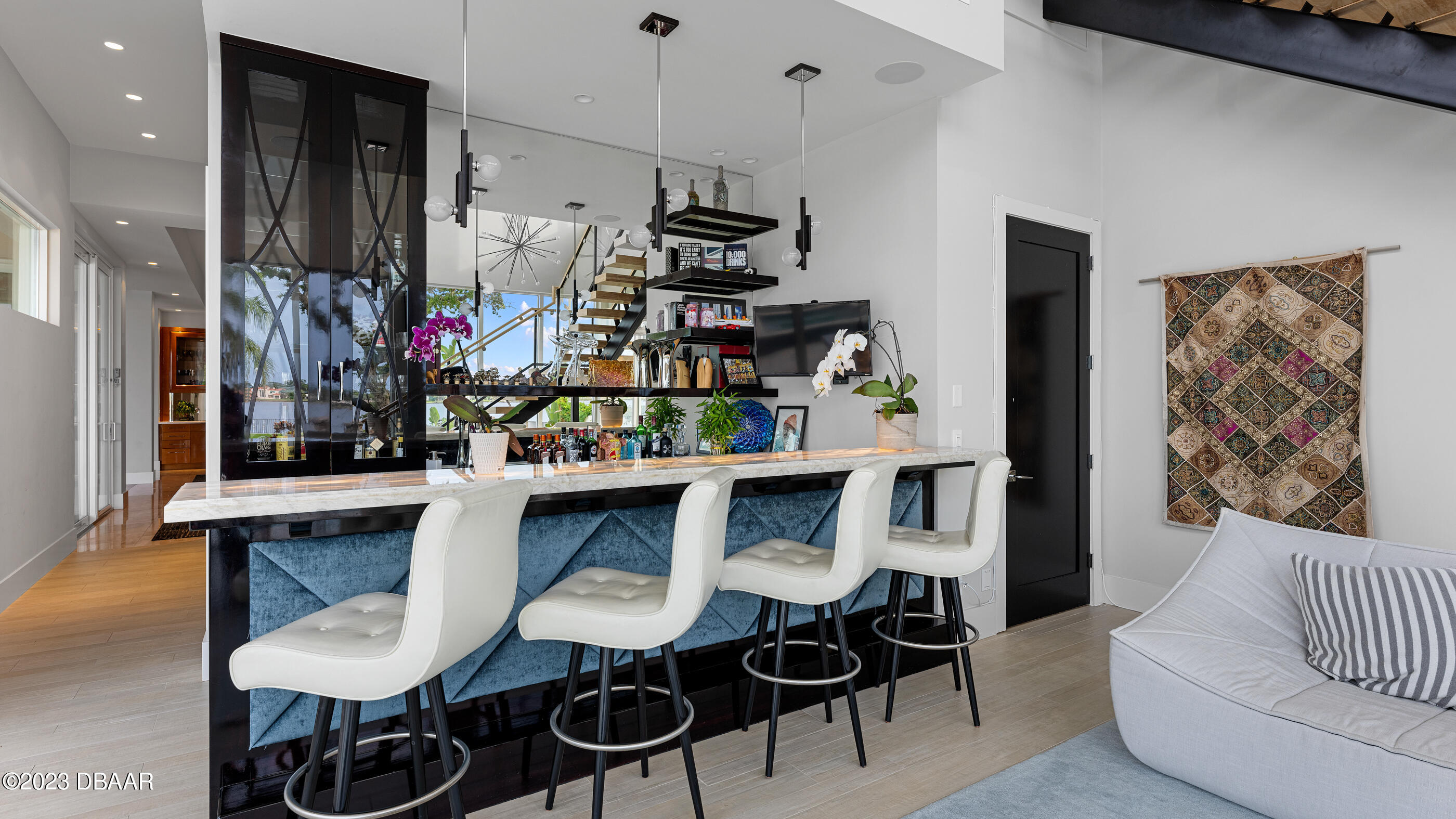 437 North Beach Street Ormond Beach, FL 32174 - Photo 31 of 162 a kitchen with stainless steel appliances kitchen island granite countertop a table and chairs in it