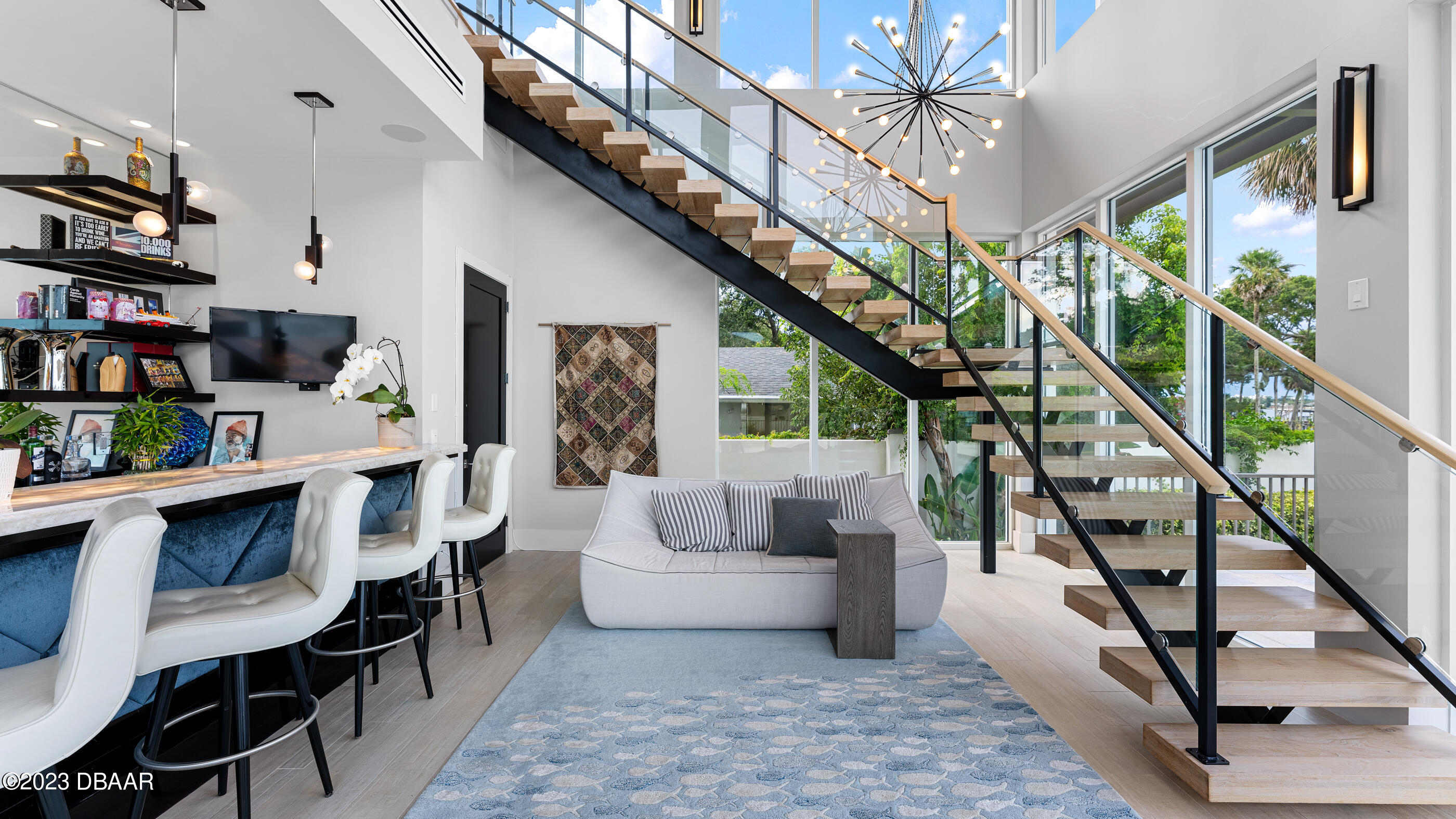 437 North Beach Street Ormond Beach, FL 32174 - Photo 33 of 162 a living room with furniture and a book shelf