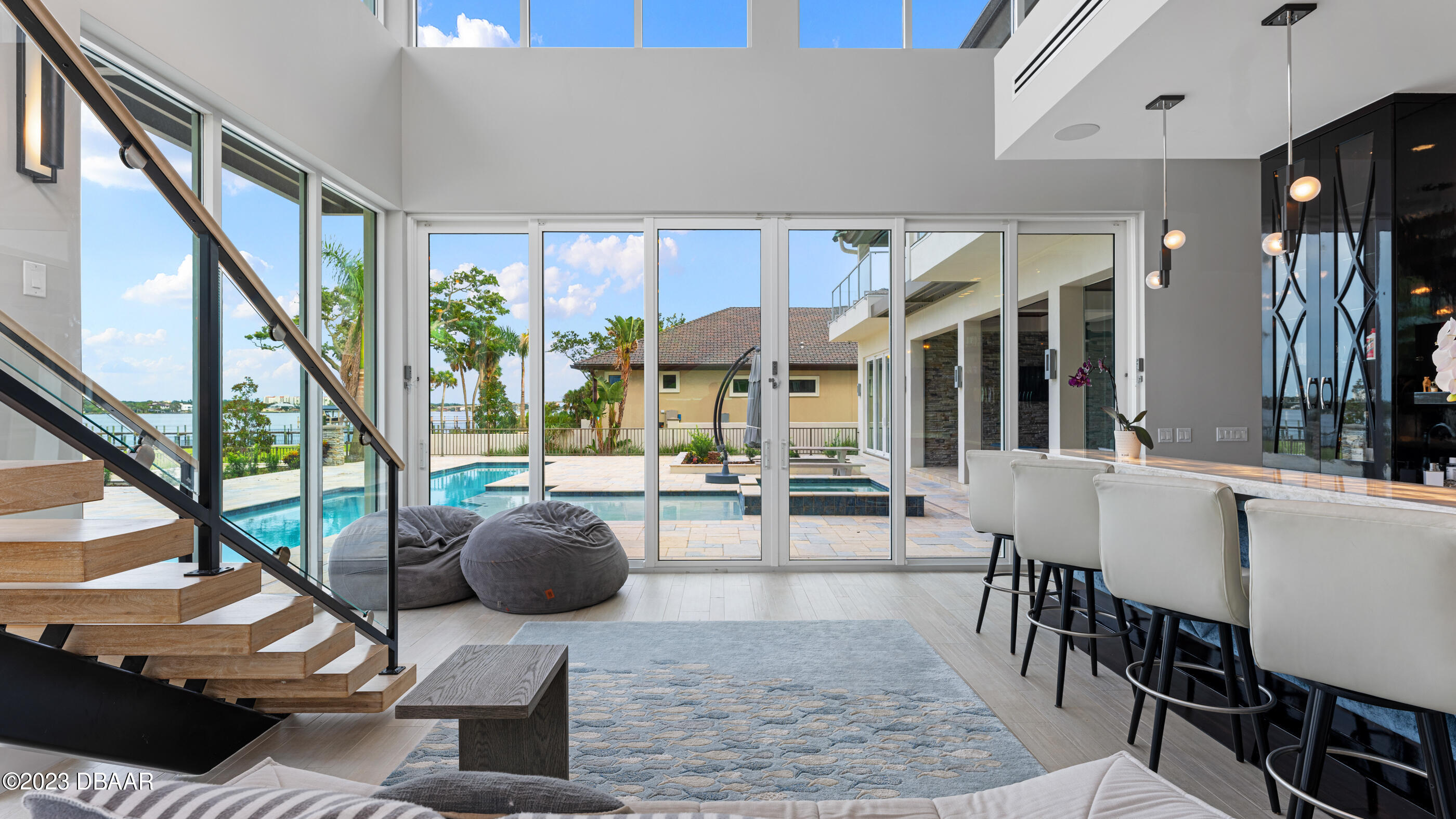 437 North Beach Street Ormond Beach, FL 32174 - Photo 35 of 162 a living room with furniture and large windows