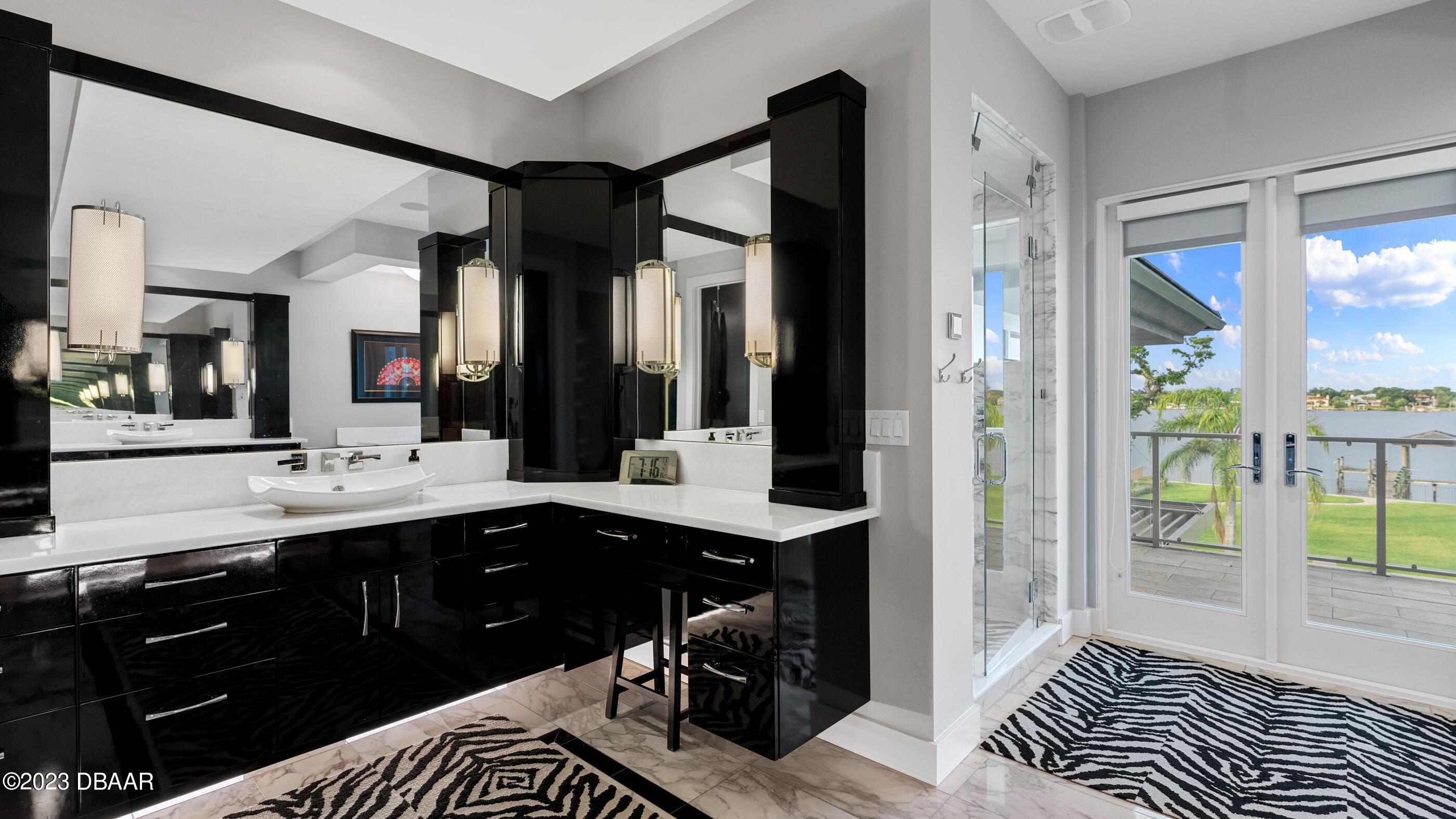 437 North Beach Street Ormond Beach, FL 32174 - Photo 48 of 162 a spacious bathroom with a sink a vanity and a mirror