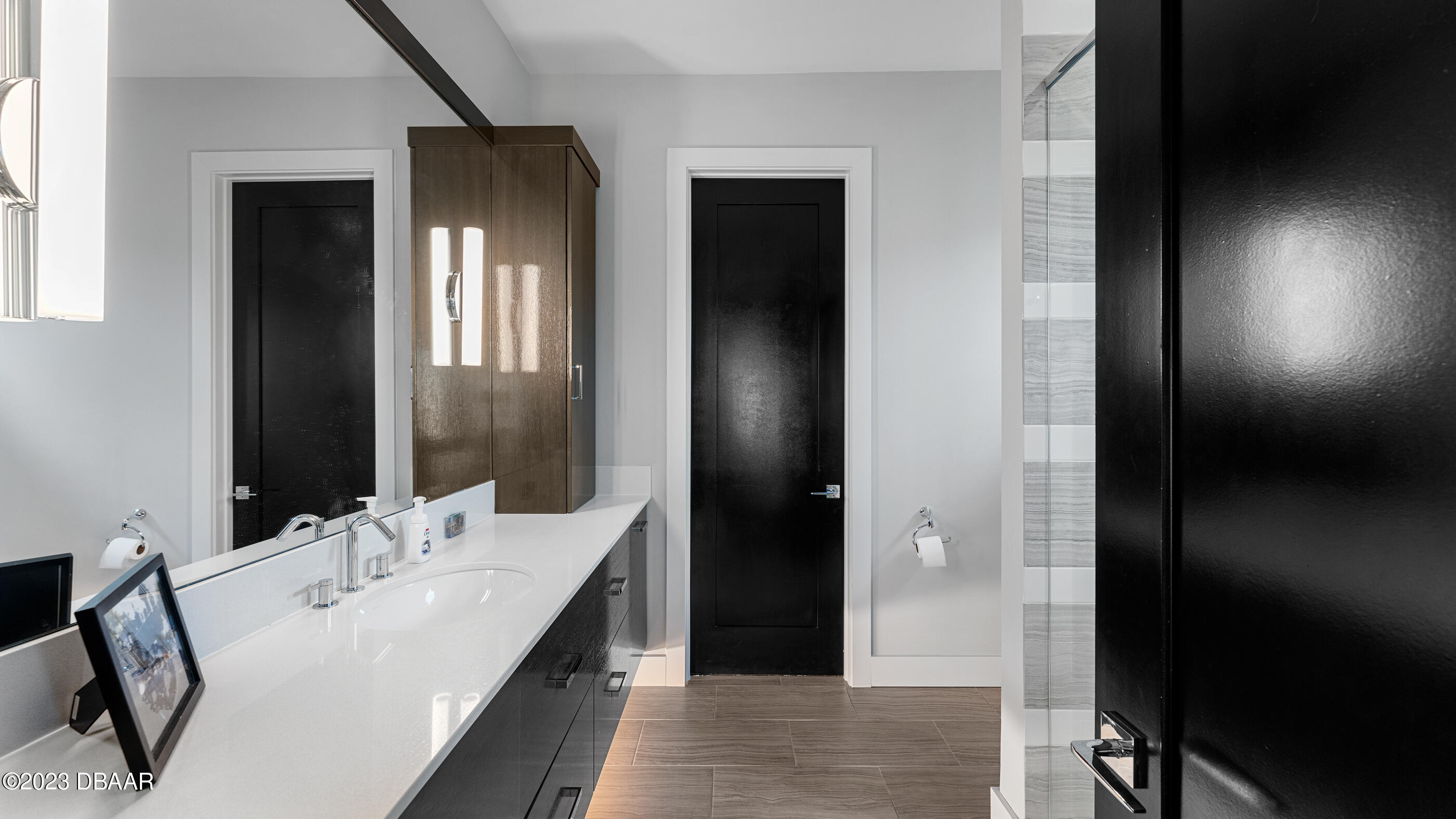 437 North Beach Street Ormond Beach, FL 32174 - Photo 61 of 162 a en suite bathroom with a double vanity sink and a mirror