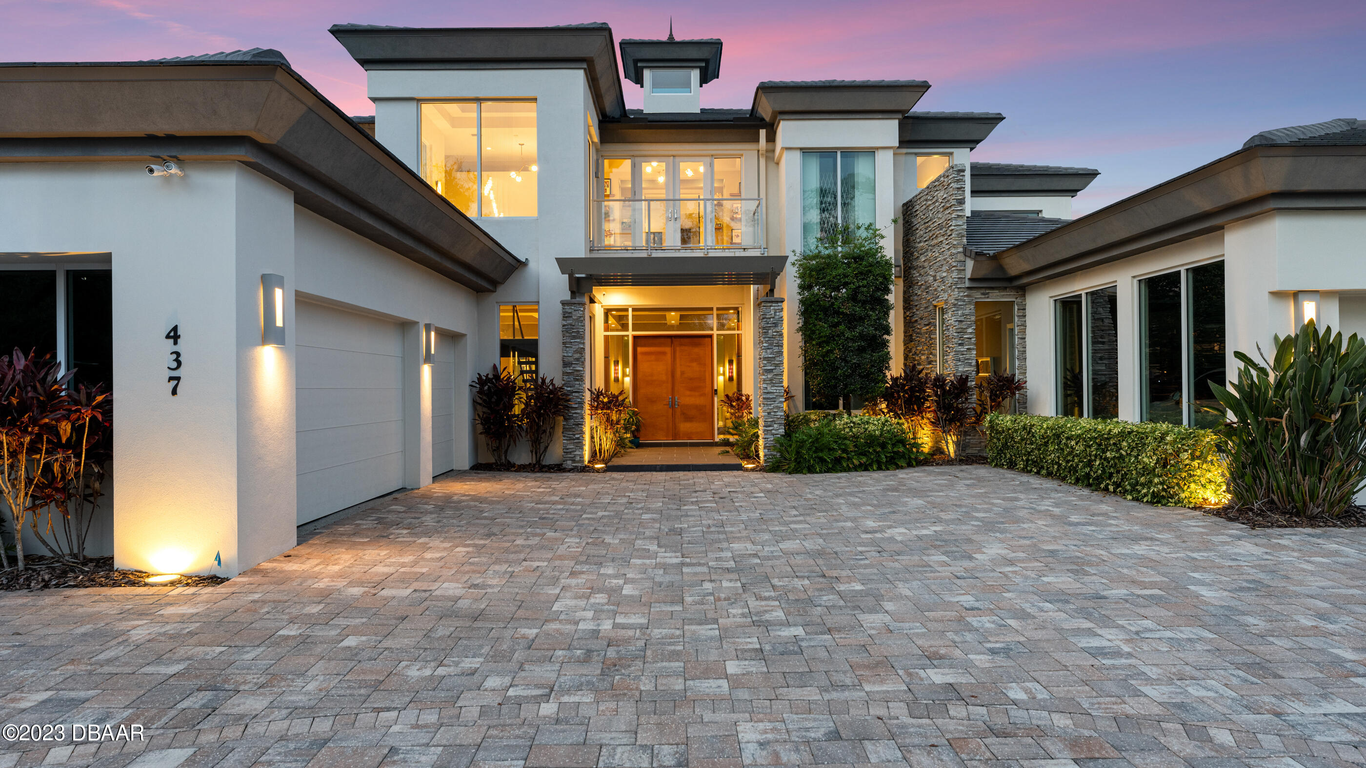 437 North Beach Street Ormond Beach, FL 32174 - Photo 8 of 162 a view of a house with brick walls and a yard