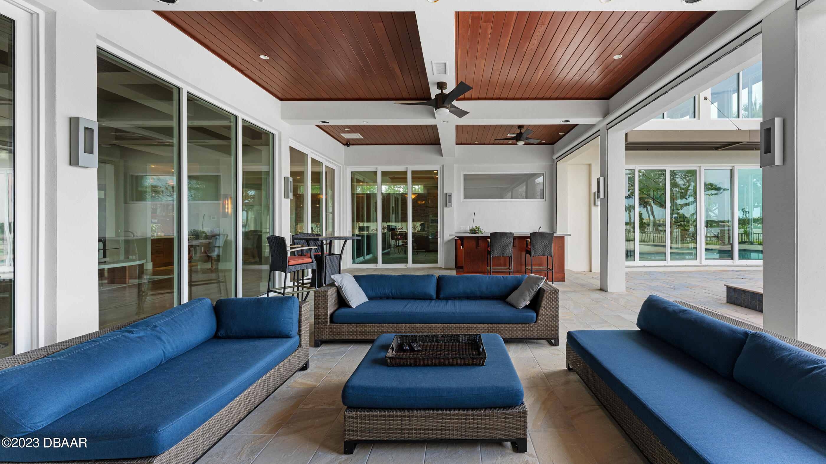 437 North Beach Street Ormond Beach, FL 32174 - Photo 88 of 162 a living room with furniture and a large window