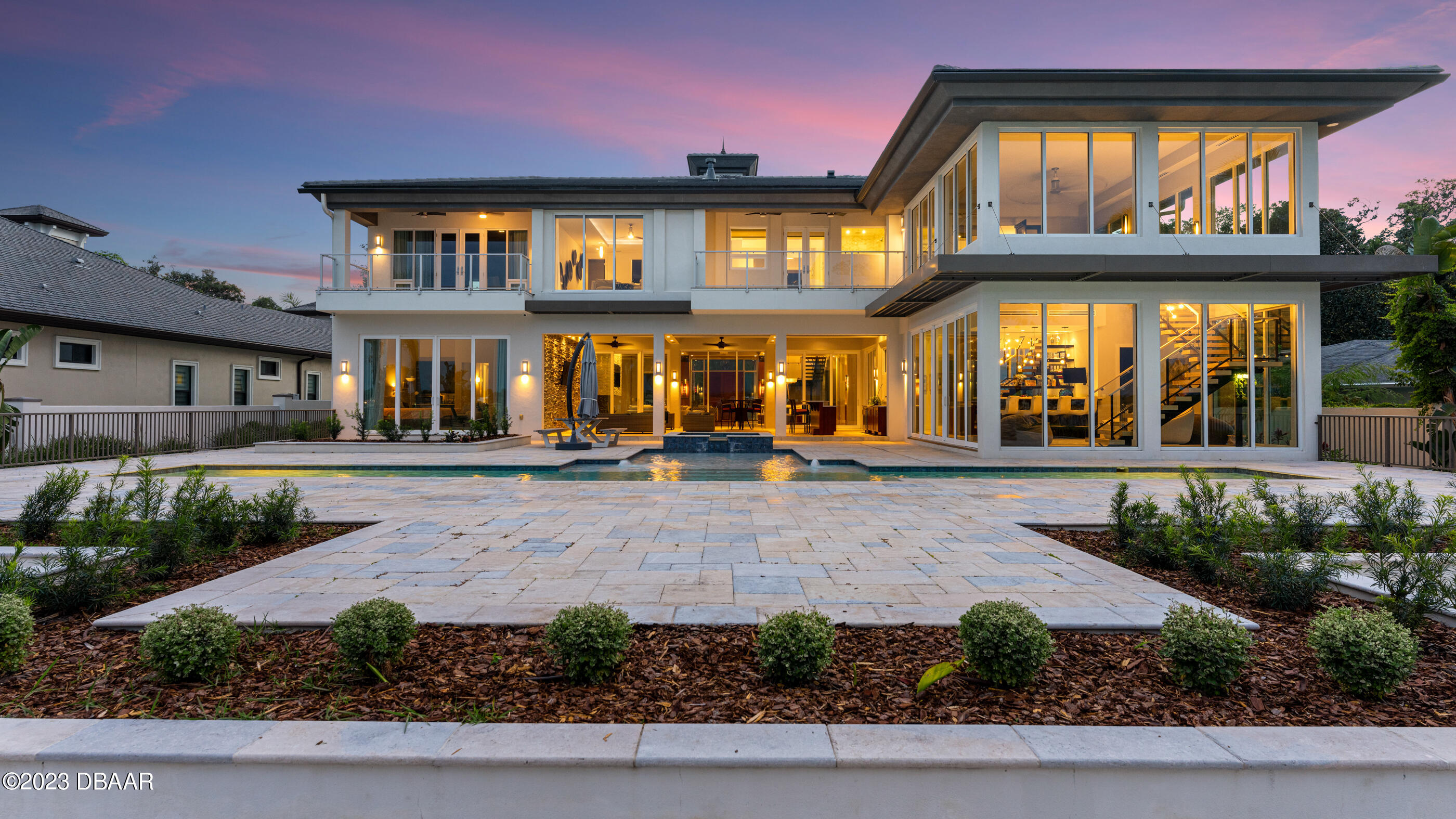 437 North Beach Street Ormond Beach, FL 32174 - Photo 90 of 162 a front view of a house with a garden