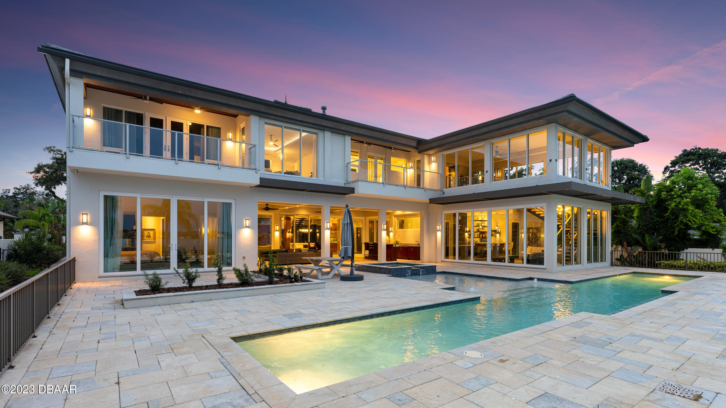 437 North Beach Street Ormond Beach, FL 32174 - Photo 92 of 162 a view of a building with a swimming pool and sitting area