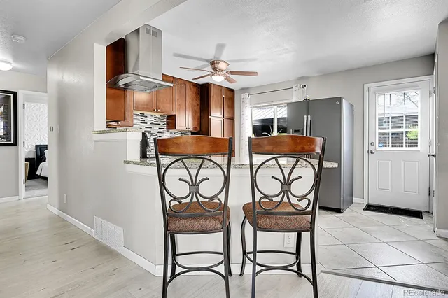a view of a livingroom with furniture and a table