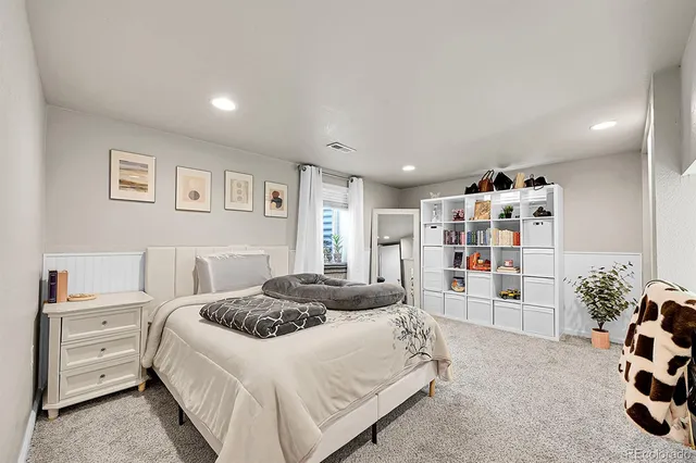 a bed room with a bed and a window