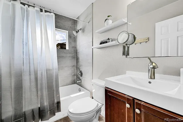 a view of a hallway and dining room with wooden floor