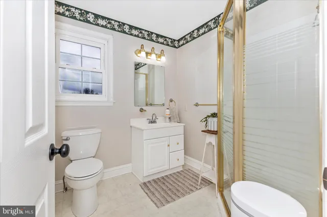 a view of a workspace with furniture and a flat screen tv