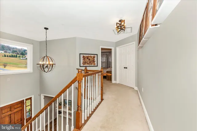 a bathroom with a toilet a sink a vanity and a mirror