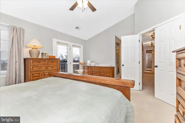 a bedroom with furniture and white walls