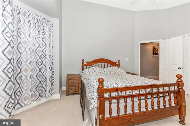 a view of a bedroom with furniture and a window