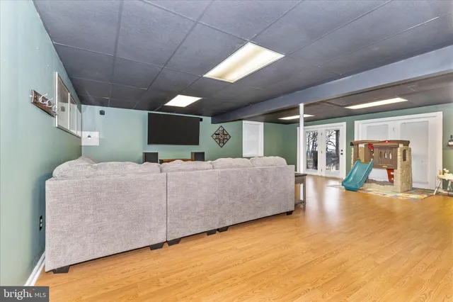 a view of a yard with swimming pool and trees