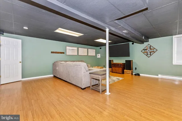 a view of balcony with wooden floor and outdoor seating
