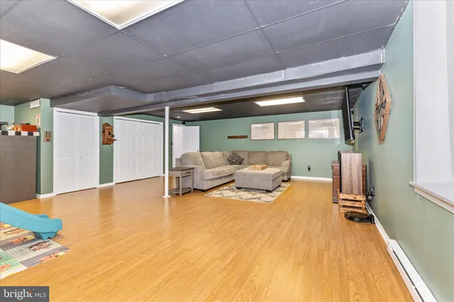 a view of a balcony with wooden floor and outdoor seating