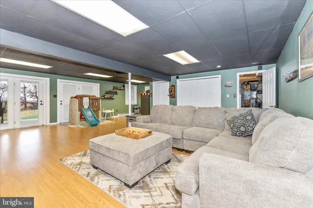a view of a deck with table and chairs and wooden floor