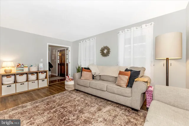 a view of a work space with wooden floor and a ceiling fan