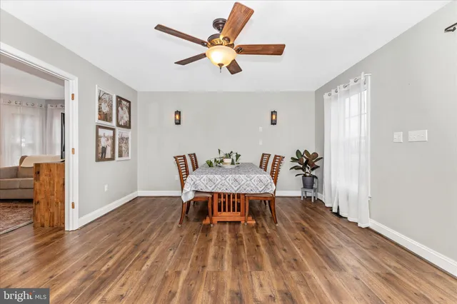 a kitchen with stainless steel appliances a sink dishwasher a stove top oven a refrigerator with island and cabinets