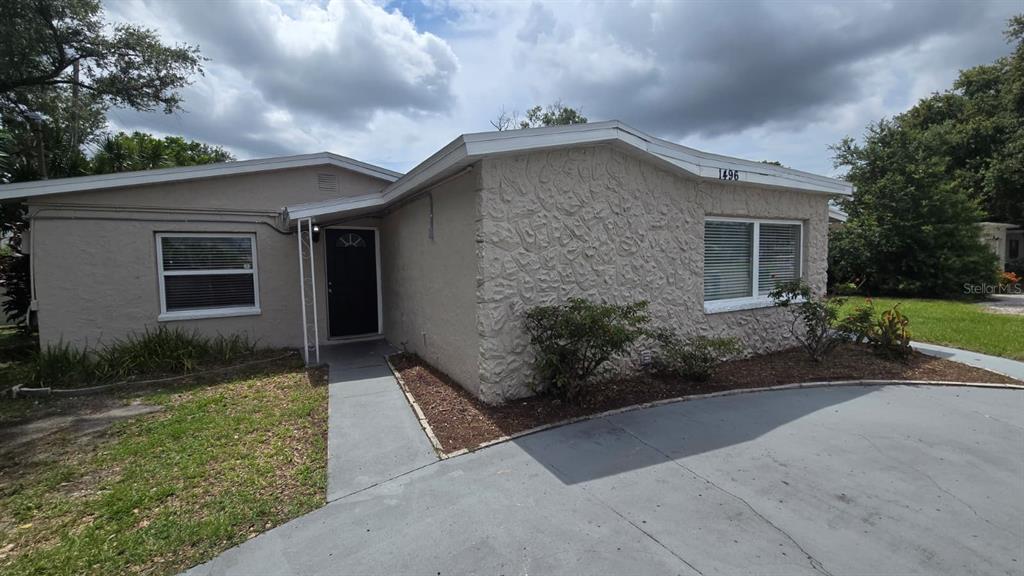 1496 South Belcher Road Largo, FL 33771 - Photo 1 of 1 a house with yard and a outdoor space