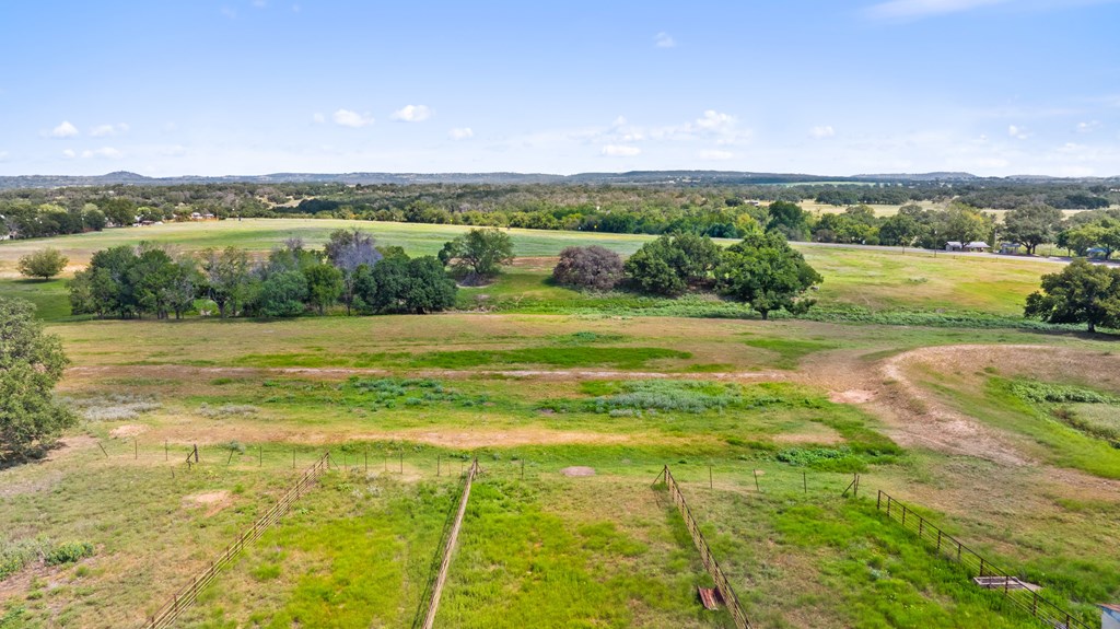 131 Elberta Street Stonewall, TX 78671 - Photo 18 of 71 a view of a lake with a big yard