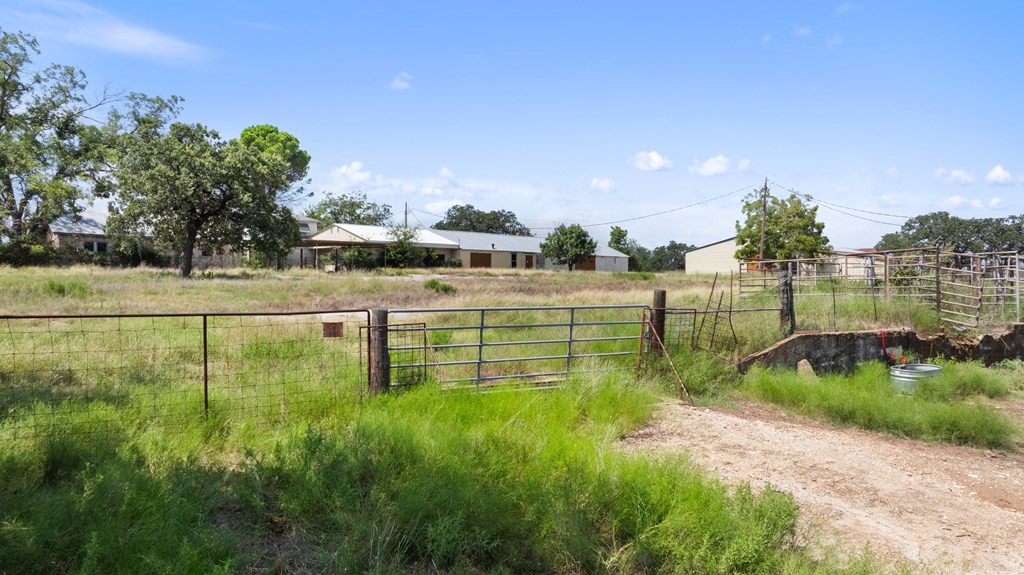 131 Elberta Street Stonewall, TX 78671 - Photo 23 of 71 a view of a lake with houses